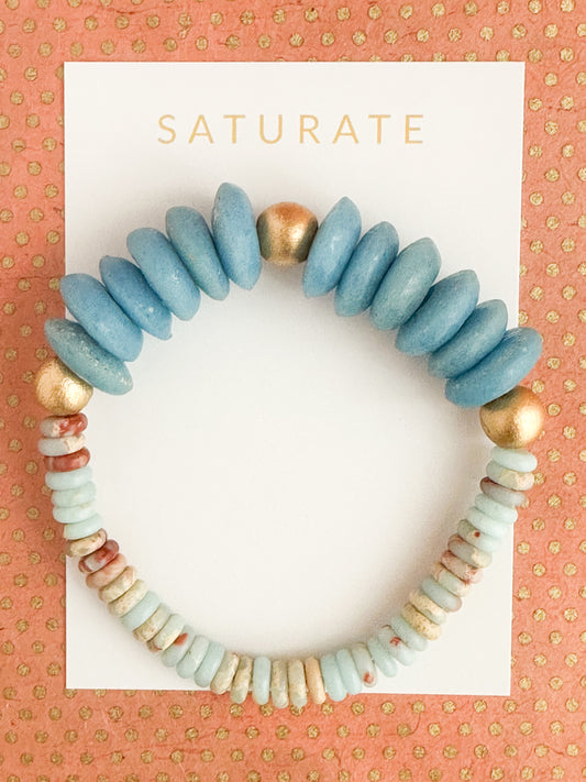 Boho stretch bracelet with gold, blue, and earthy tones. Great paired with our Michaela Necklace