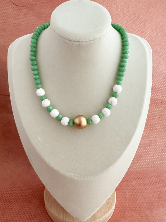 Green moonstone and carved coral beachy necklace with brushed gold center piece.