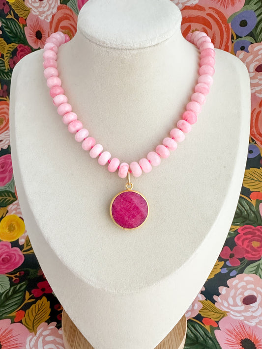 Silk-knotted pink jade necklace with a pink  faceted jade pendant. Handmade in USA.