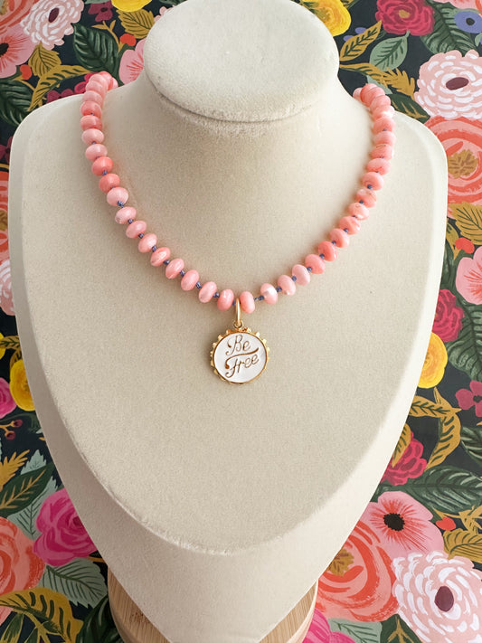 Pink mother of pearl silk knotted necklace with charm.