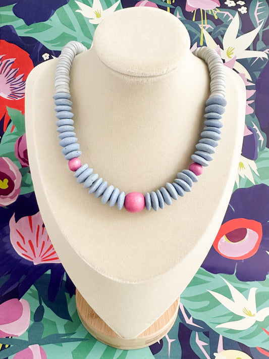Boho, vibrant statement necklace made with light blue African saucer necklace.